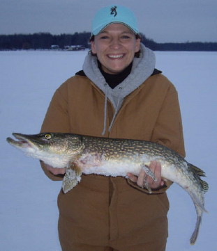 Amber S. with a 32-inch northern pike she caught in Rainbow Bay of Benoit Lake, February, 2008.