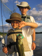 Ben's first bass with net-man, Jake, June 2006.
