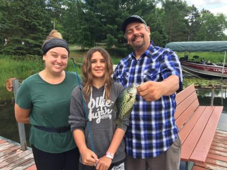 Carmen, Scarlet, and Dennis celebrate Scarlet's first crappie.  Congratulations Scarlet!  June 2021