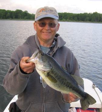 That's me, Dave, with a 19 and 1/8 inch bass I caught and released on Benoit Lake, June 2008.