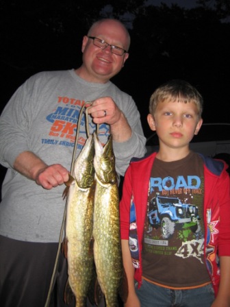 Dave and Donavan R. with a pair of nice pike caught in Rainbow Bay of Benoit Lake.  They were fishing over weeds.  Good job guys!  June 18, 2012.