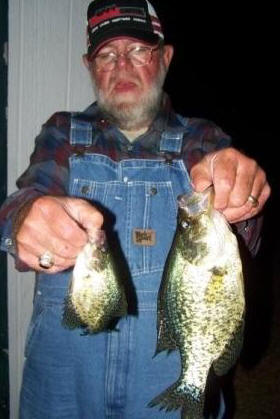 Dallas K. with a beautifuly crappie caught on a minnow in our bay, mid-July, 2009.