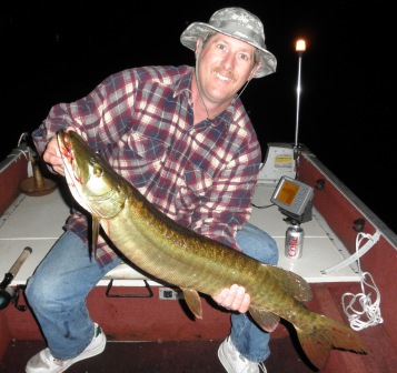 Dave B. caught and released this 34 + inch musky on Benoit Lake.  Carolyn B. took the photo.  Great catch!