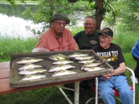 George N, Dave C., and my Dad, George C., with a mess of eater bass, Rainbow Bay Resort on Benoit Lake, June, 2018.