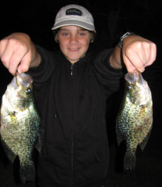 Jake K with a pair of black crappies he caught on Benoit Lake using tube jigs in about 14 feet of water.