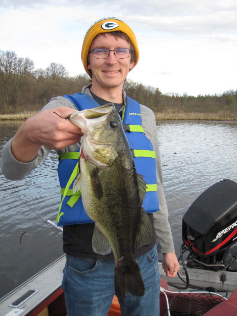 Jake C with one of 3 bass he caught in a 15-minute span on Benoit Lake, May 2021.