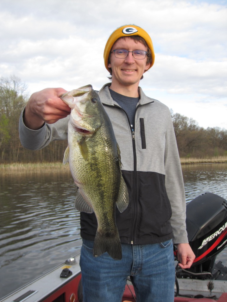 Jake C with one of 3 bass he caught in a 15-minute span on Benoit Lake, May 2021.
