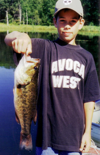 Jordan R. with a good bass, 2003.