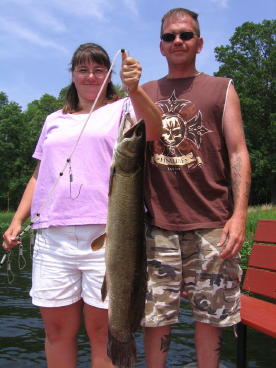 Lynn and Mike Helgeland with a nice bowfin she caught on our lake.  At the time, this was the record bowfin for our resort.