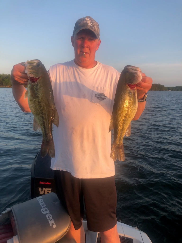 Mark C with a pair of nice bass from a Burnett County, Wisconsin lake; May 2021.
