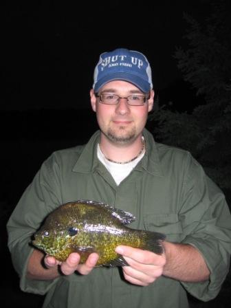 Nate Gassen with a 9.5 inch pumpkinseed he caught on Benoit Lake on May 26, 2009. He was using a worm and a bobber.
