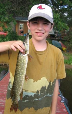 Robbie B. with the first northern pike he ever caught.