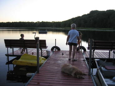 Our main dock at sunset.  Notice the swim raft in the lake.