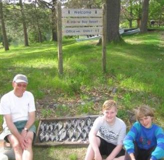 Dave, Zac, and Ben with 21 crappies they caught on fine May afternoon.
