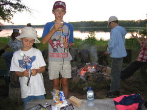 Roasting marshmallows over the campfire with a view of the lake at sunset - it doesn't get much better.