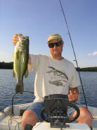 Doug with a great bass from Benoit Lake, spring 2006.