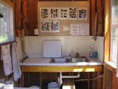 Our fish cleaning house has running water, lights, screens, a fan, and no stink!