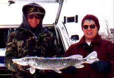 Dave and his friend, Judy, with a 28 inch pike from a nearby lake, December 2002.