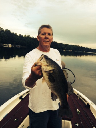 Mark C. with a nice bass he caught and released on a nearby lake, early-June 2015.